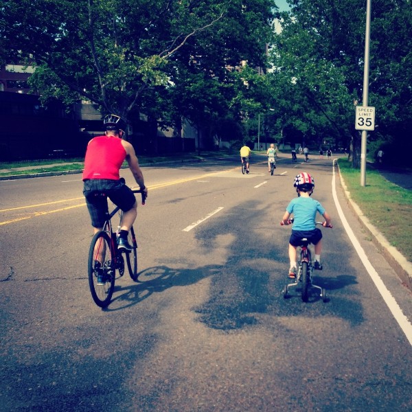 Bryan and child riding a bike 2