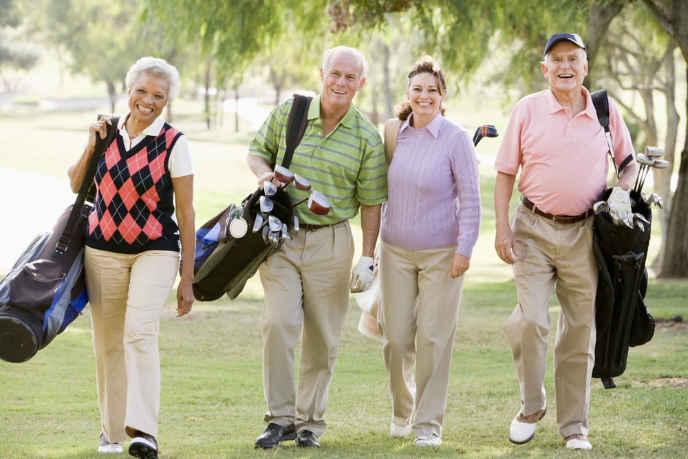 Portrait Of Four Friends Enjoying A Game Golf